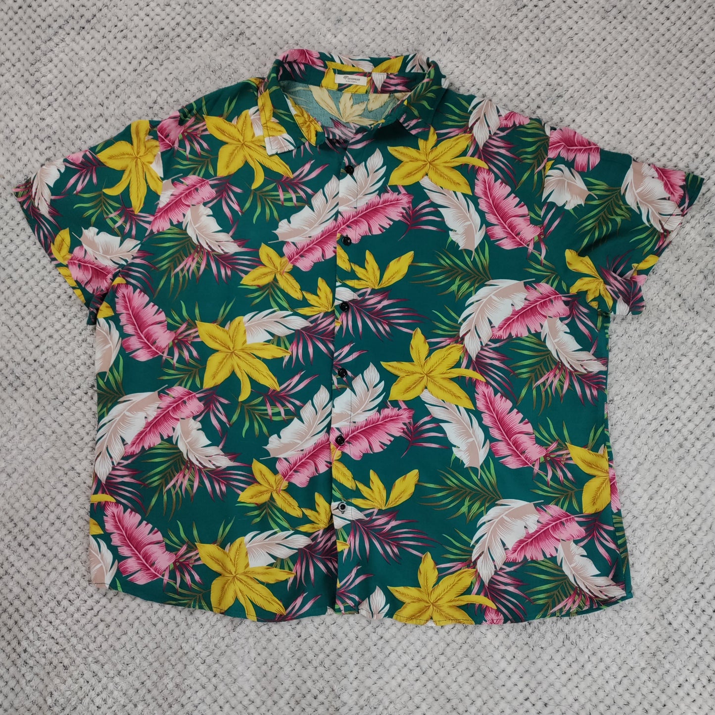 Hawaiian shirt with floral pattern on a textured surface