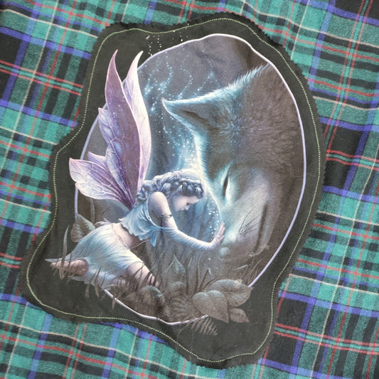 Fairy and cat illustration on a plaid fabric background