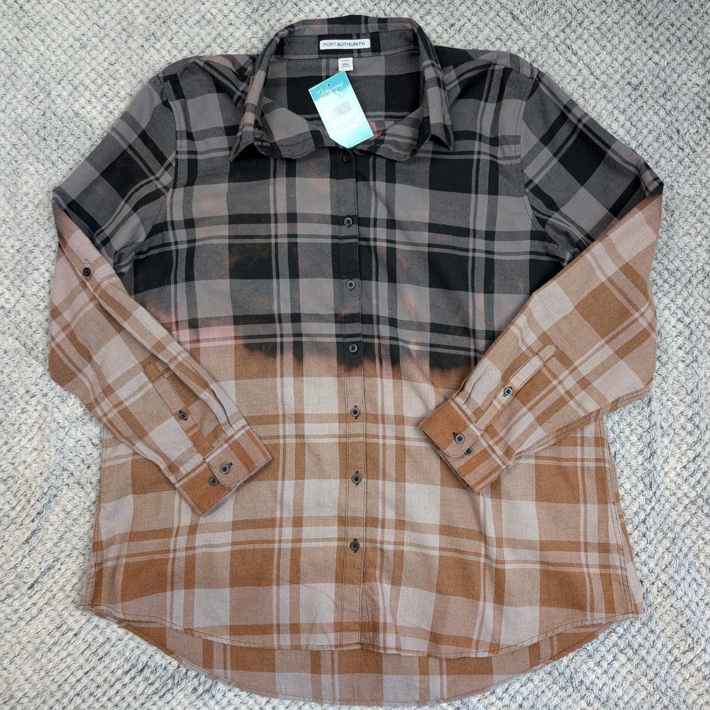Plaid shirt with gradient pattern on a textured surface
