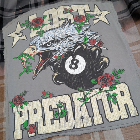 Embroidered patch with an eagle, number 8 ball, and roses on a gray background