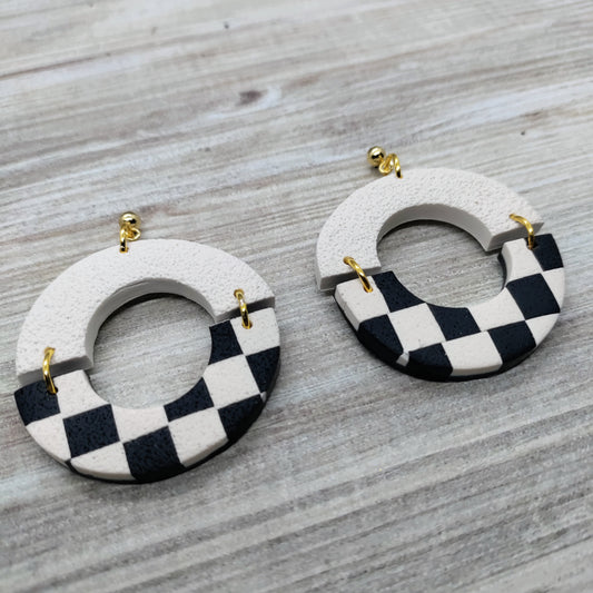Pair of earrings with checkered design.