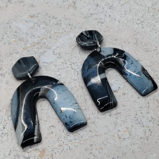 Pair of black and blue abstract earrings 