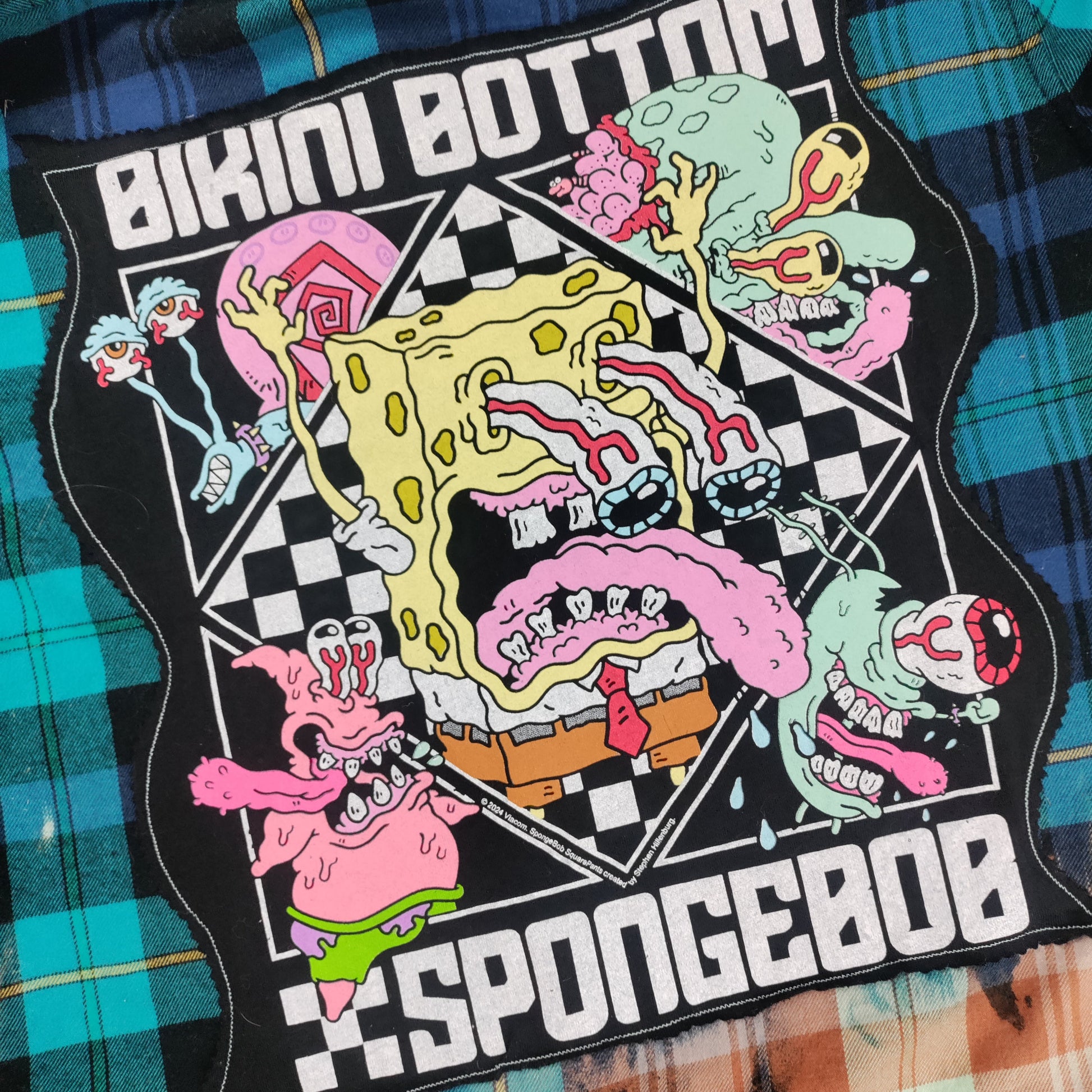 SpongeBob SquarePants patch with characters and 'Bikini Bottom' text on a plaid fabric background