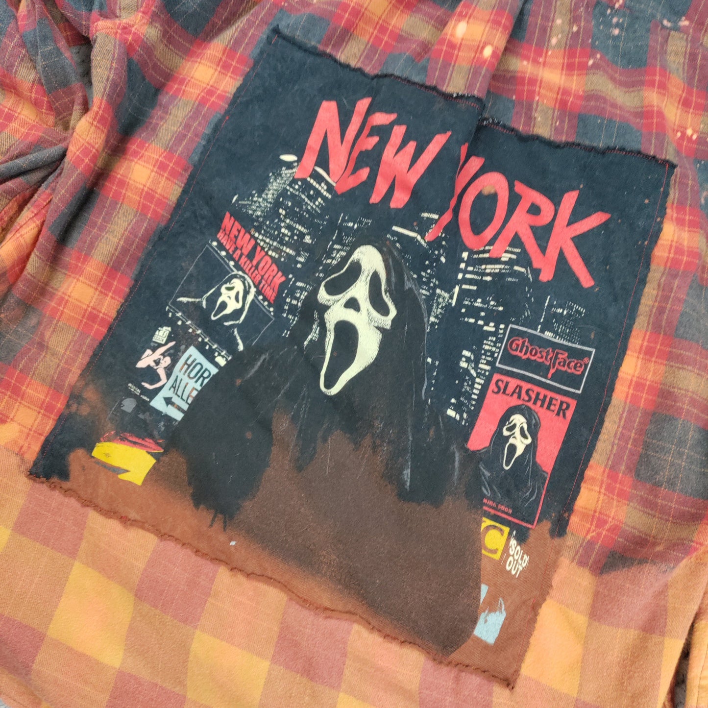 T-shirt with 'New York' and horror movie character graphics on a plaid fabric background