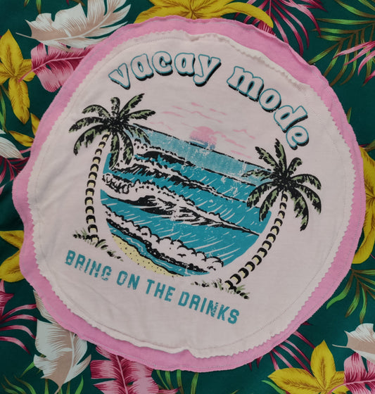 Patch with 'vacay mode' design on a floral background