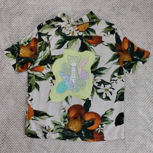 Fabric with floral and fruit pattern on a textured surface