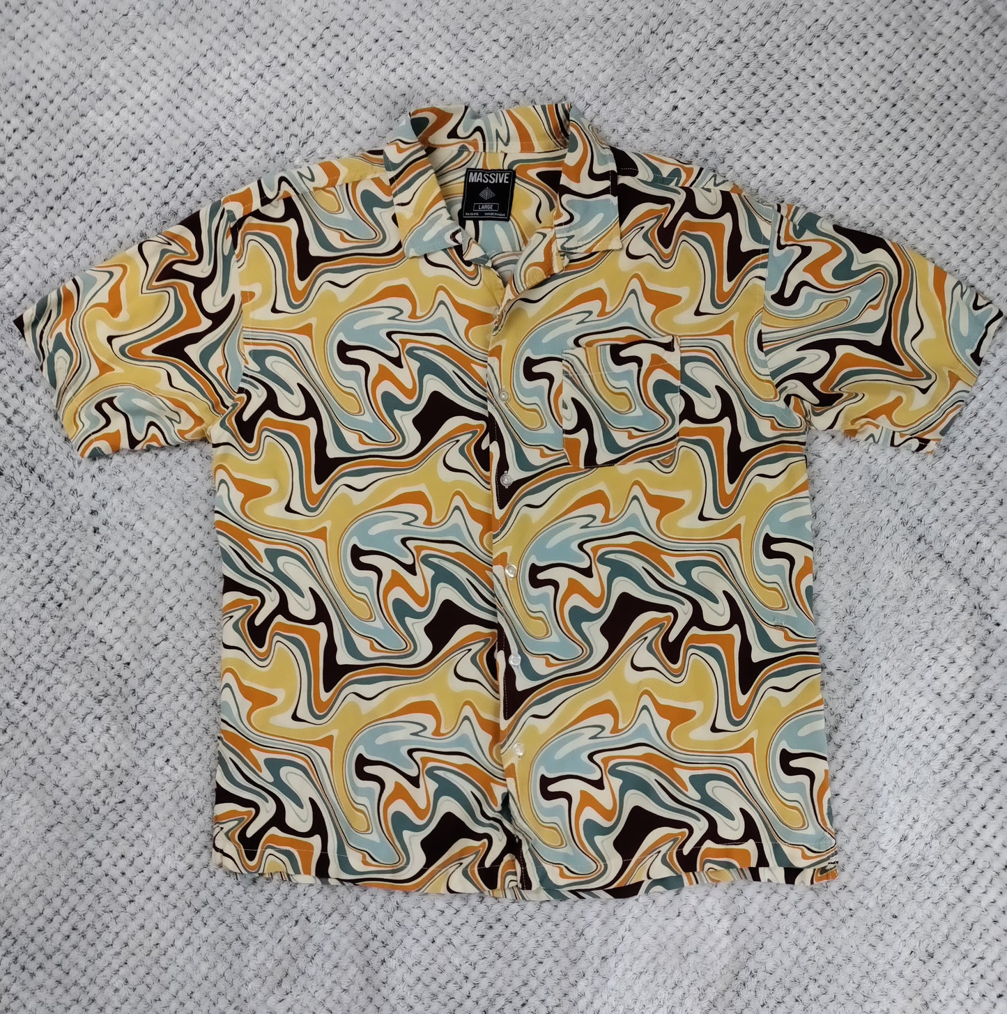 Abstract patterned shirt on a textured gray background