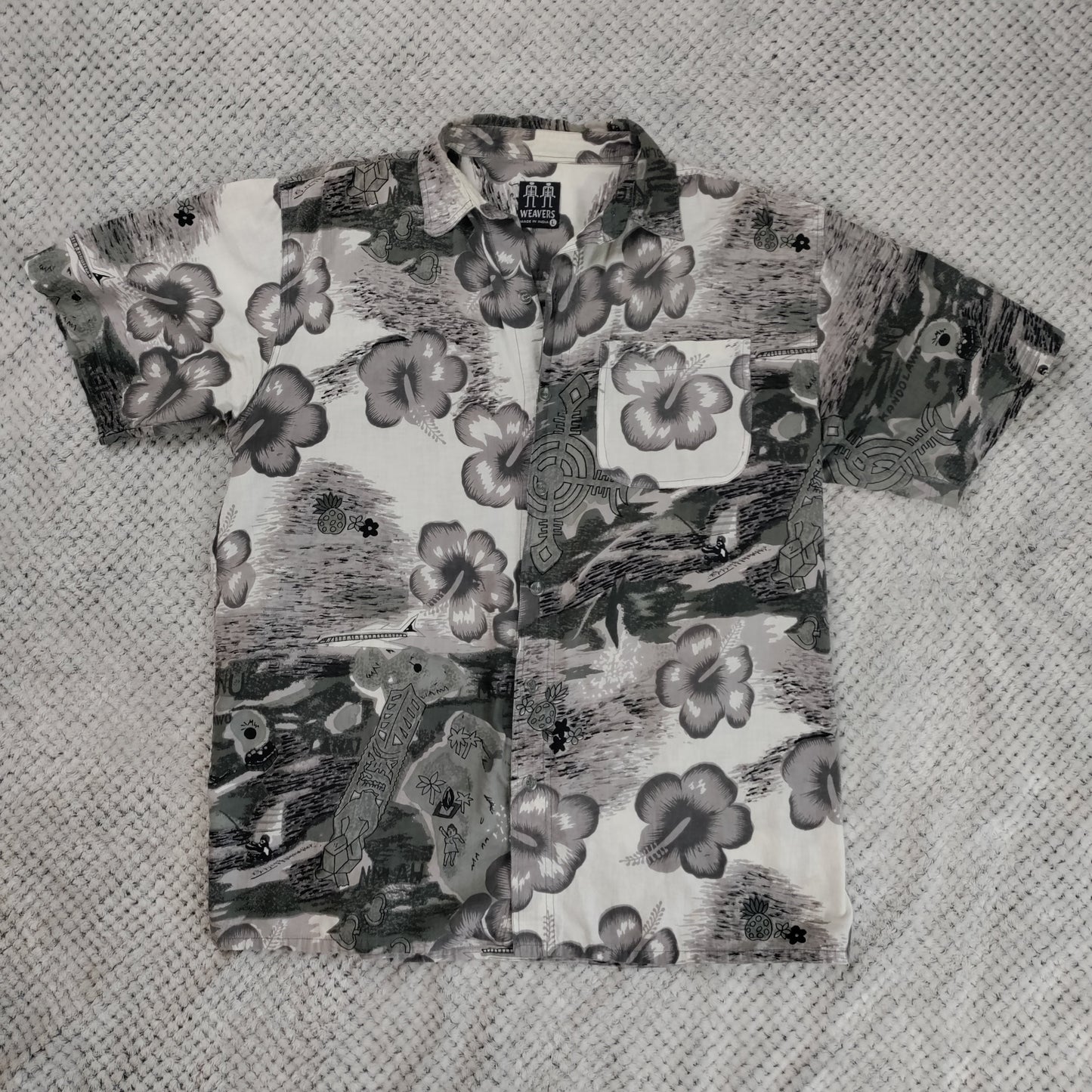 Hawaiian shirt with floral pattern on a textured surface