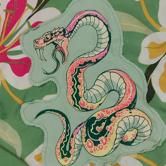Colorful snake design on a floral background