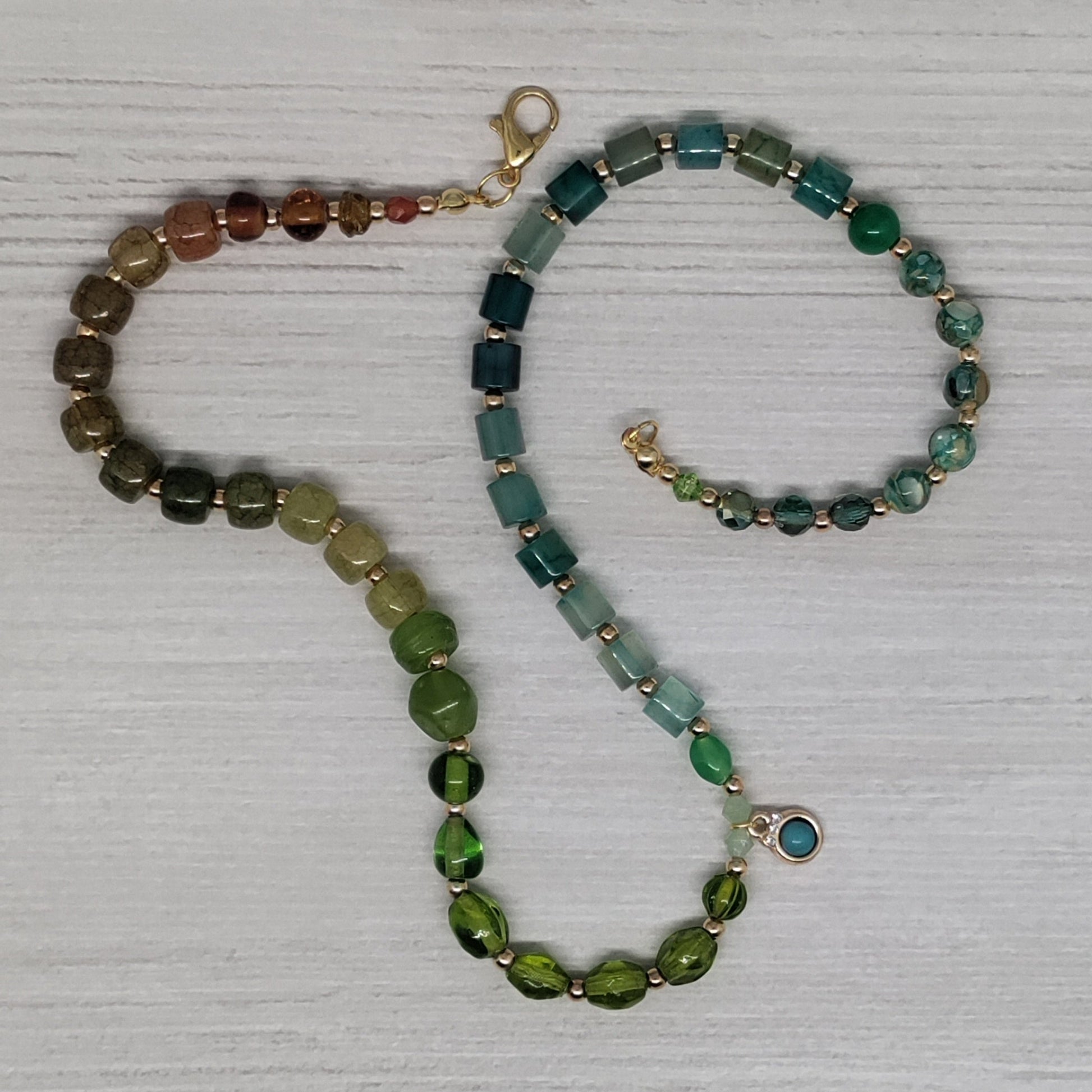 Necklace with multicolored beads on a textured white surface