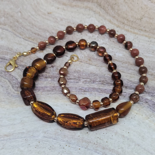 Beaded necklace on a textured surface