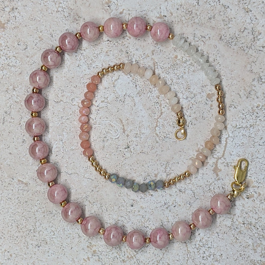 Beaded necklace and bracelet set on a textured surface