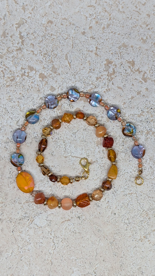 Necklace with multicolored beads on a textured surface