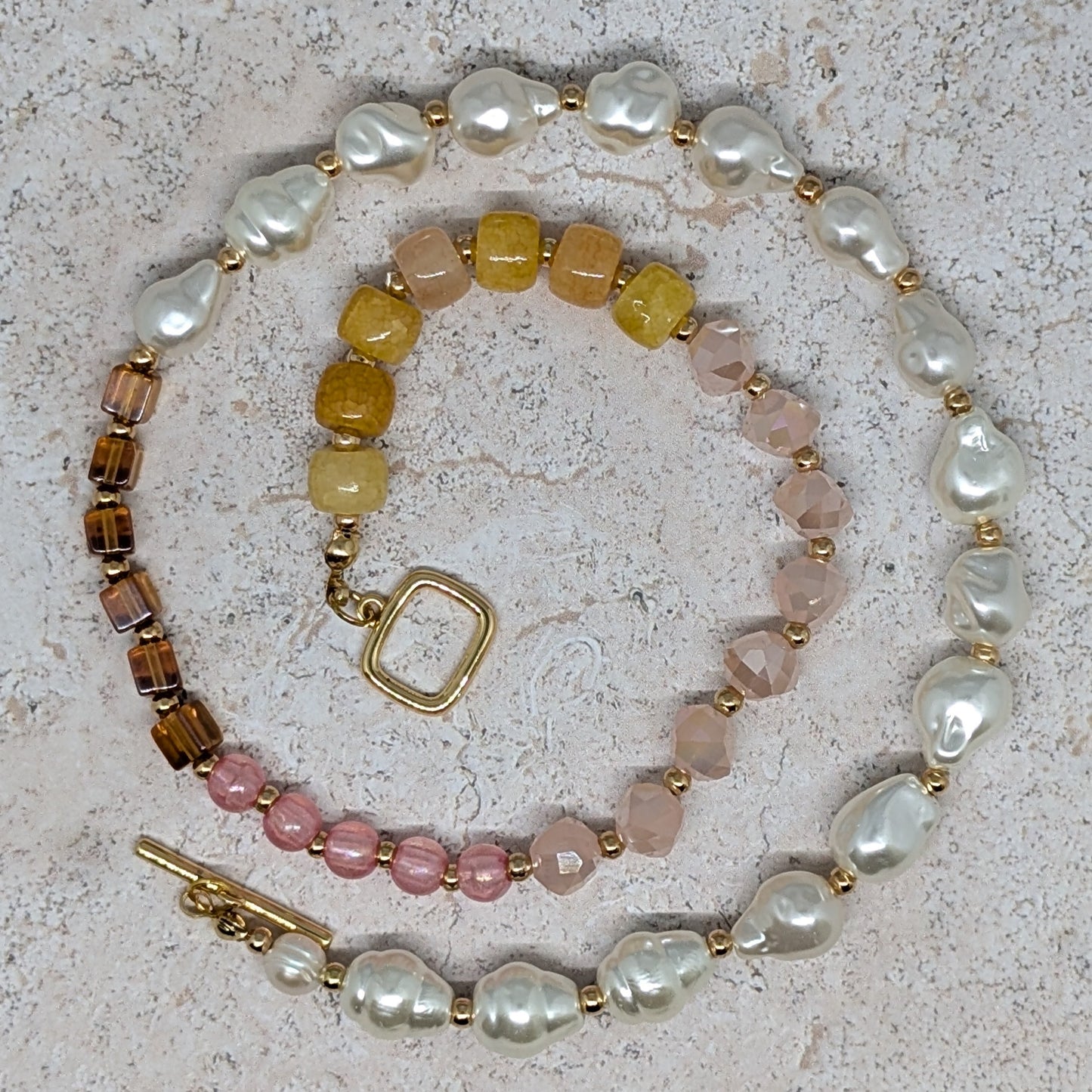 Set of beaded bracelets on a textured surface