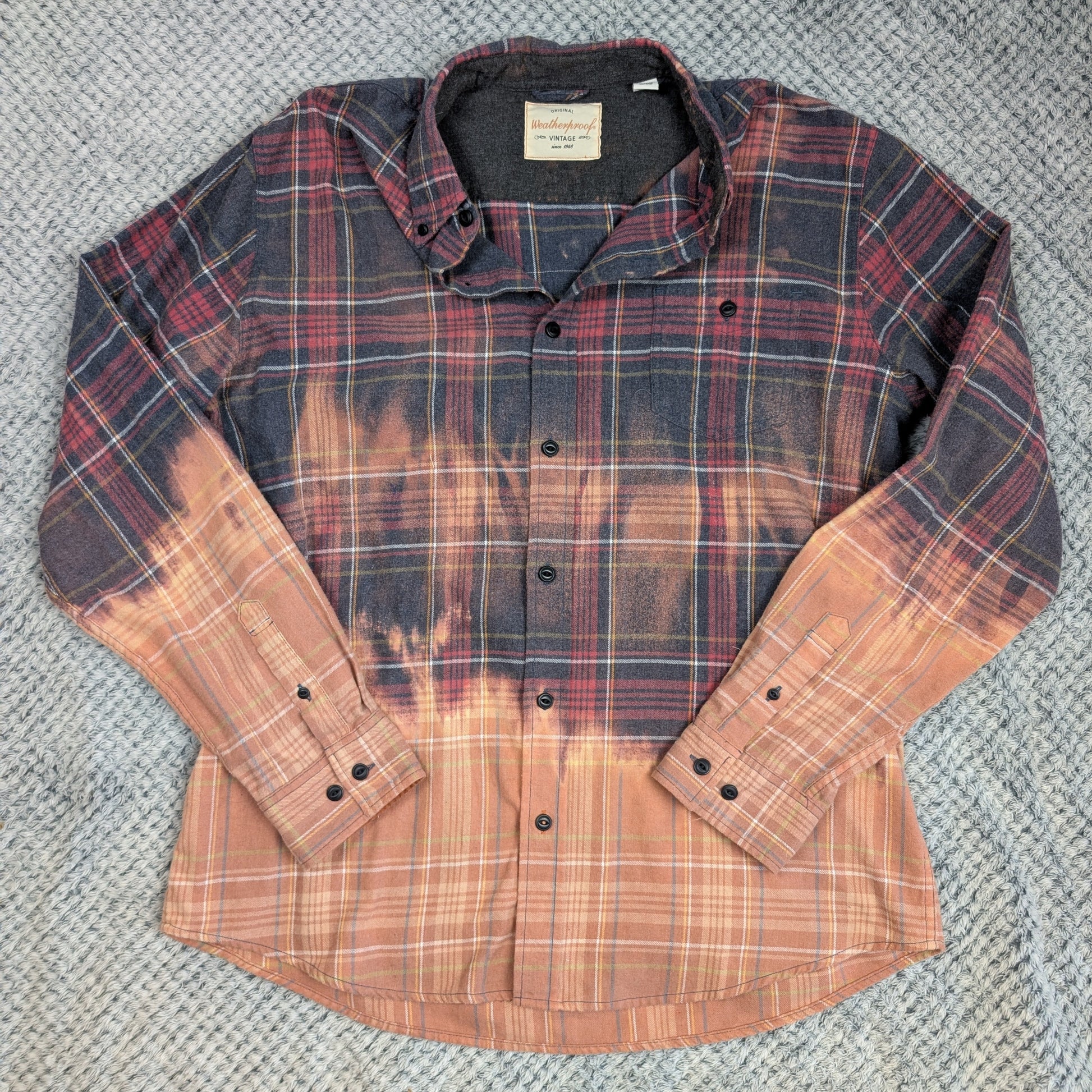 Plaid shirt with gradient color effect on a textured surface