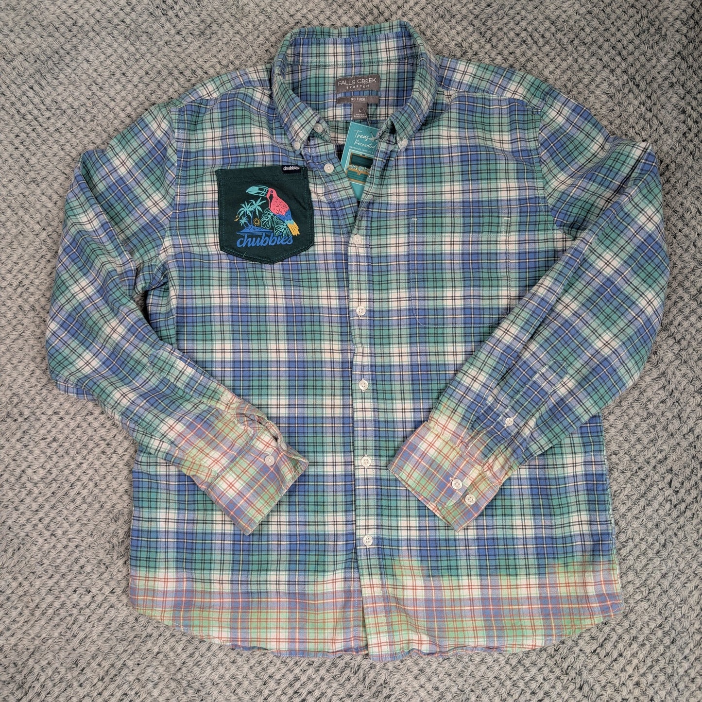 Plaid shirt with a logo on a textured gray background