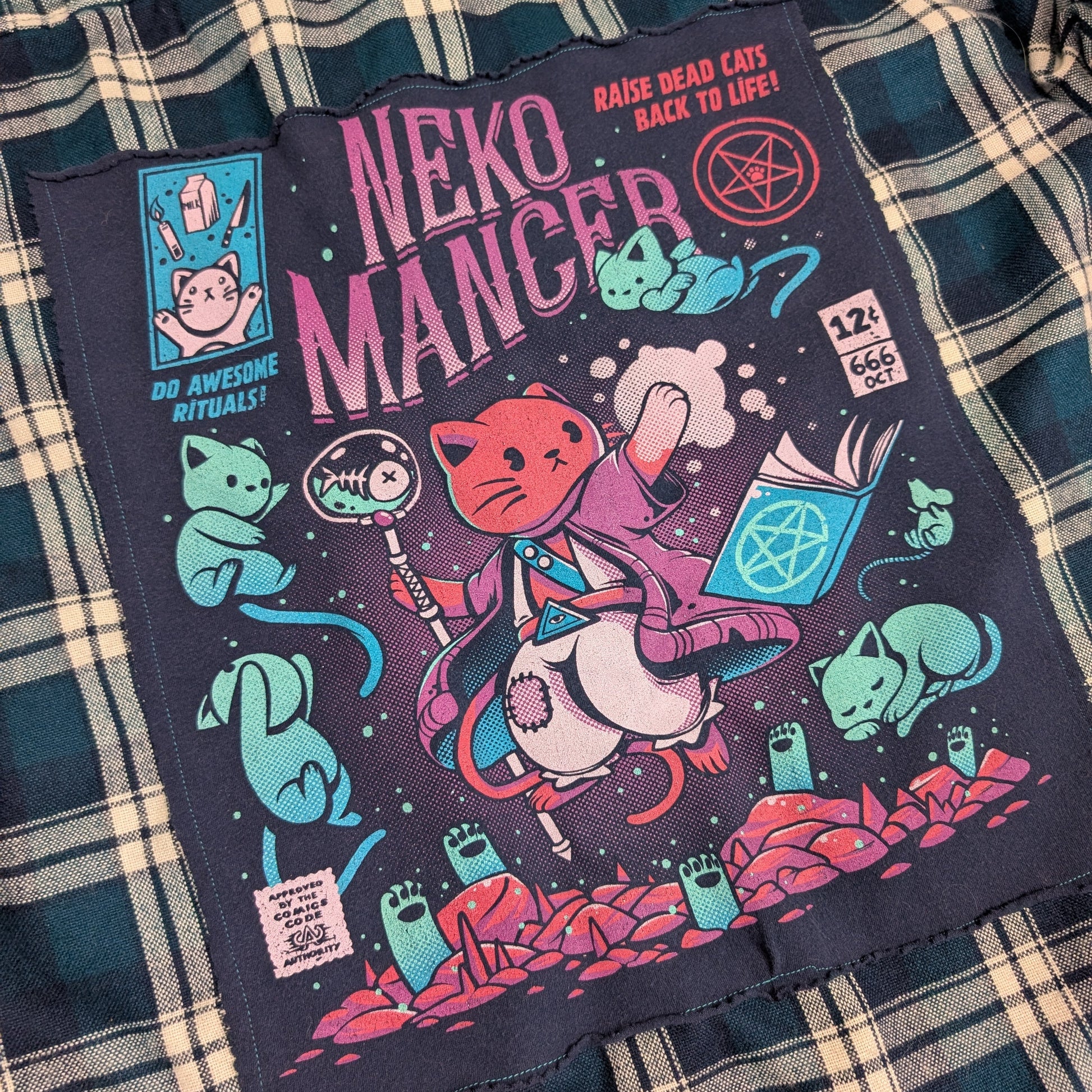 Neko Mancer product packaging on a plaid fabric background