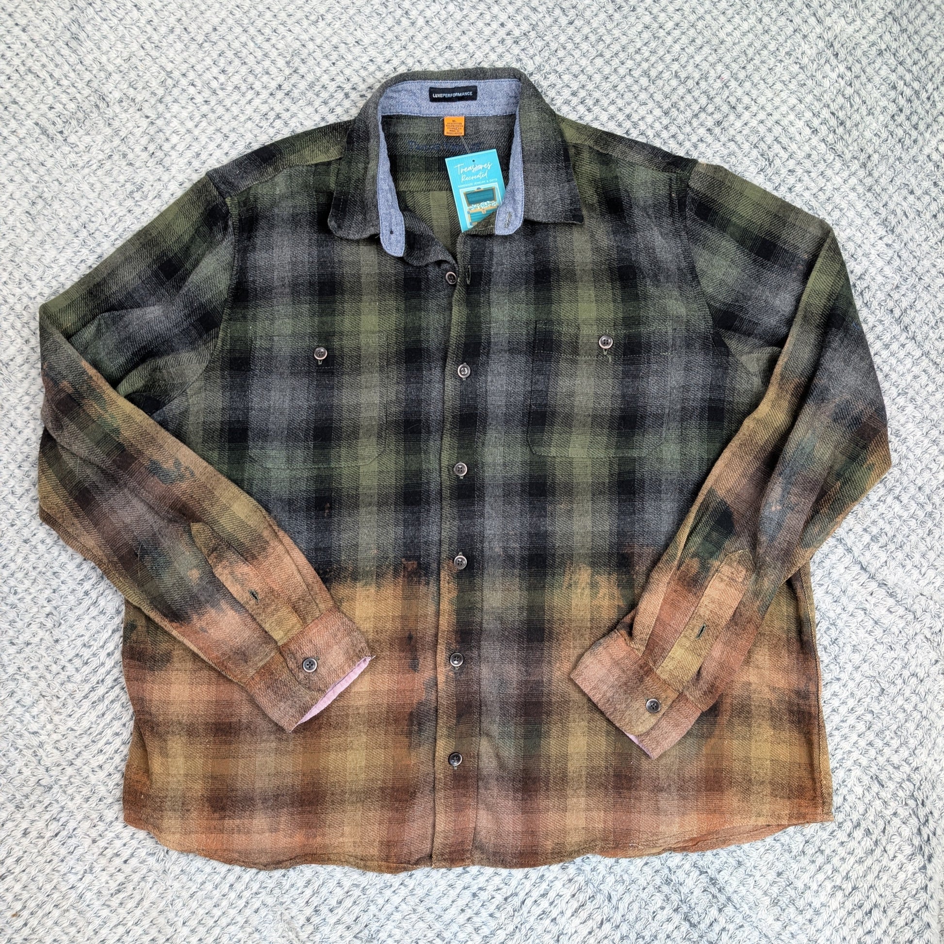 Plaid shirt with brown accents on a textured surface